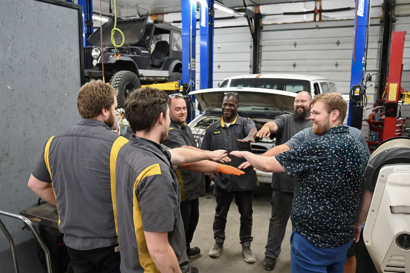 Auto Repair at The Hive team working together in the Moscow, Idaho repair shop